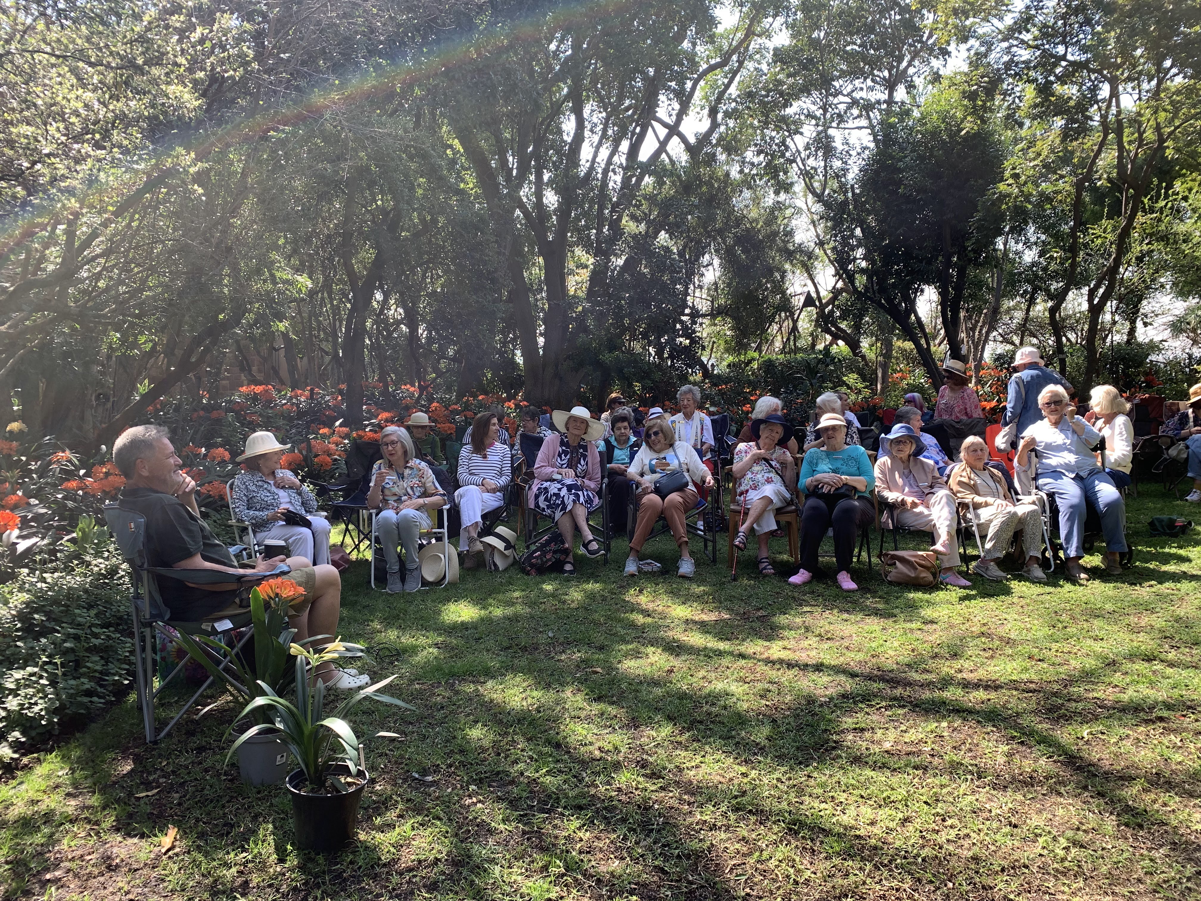 Country Garden Club members gathered in a garden